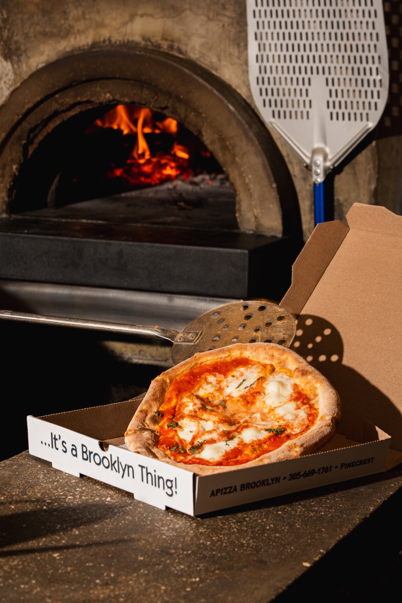 Wood-fired pizza from Apizza Brooklyn oven